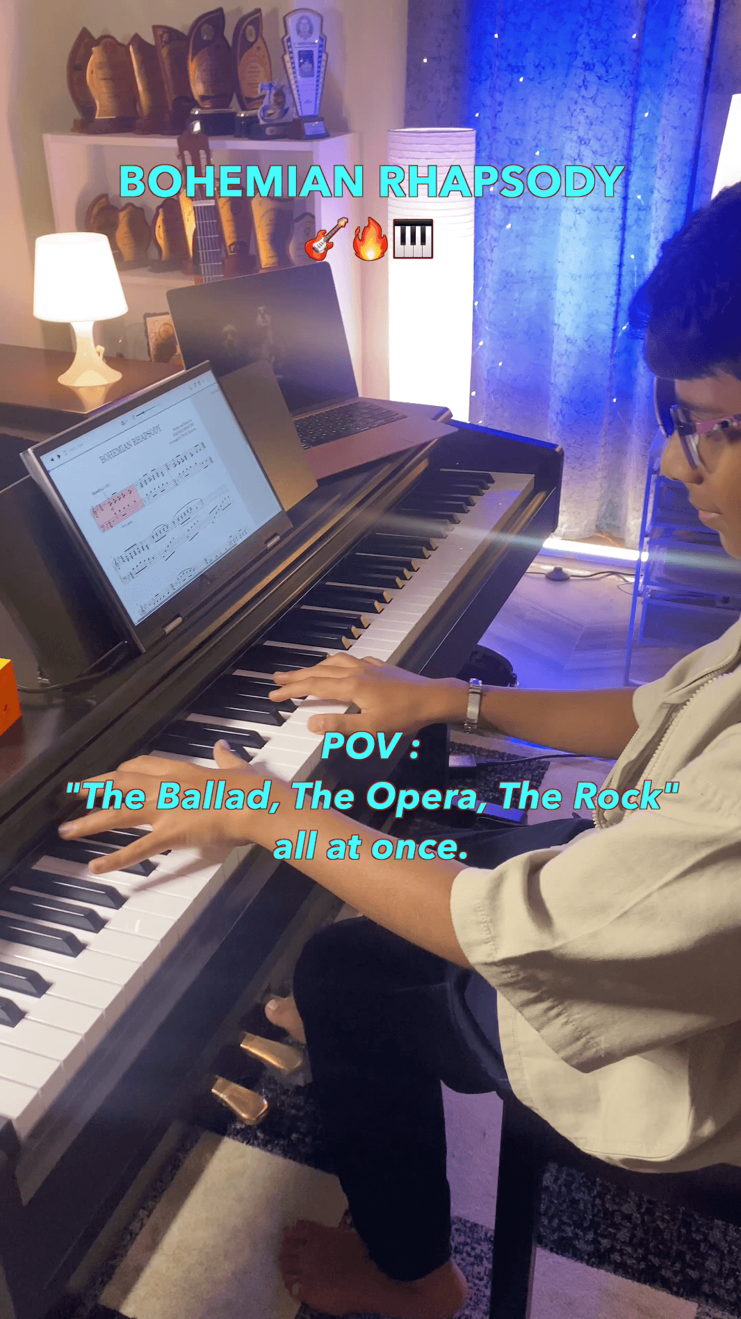 Bala at a digital piano, hands on the keys, with sheet music titled Bohemian Rhapsody on a laptop.