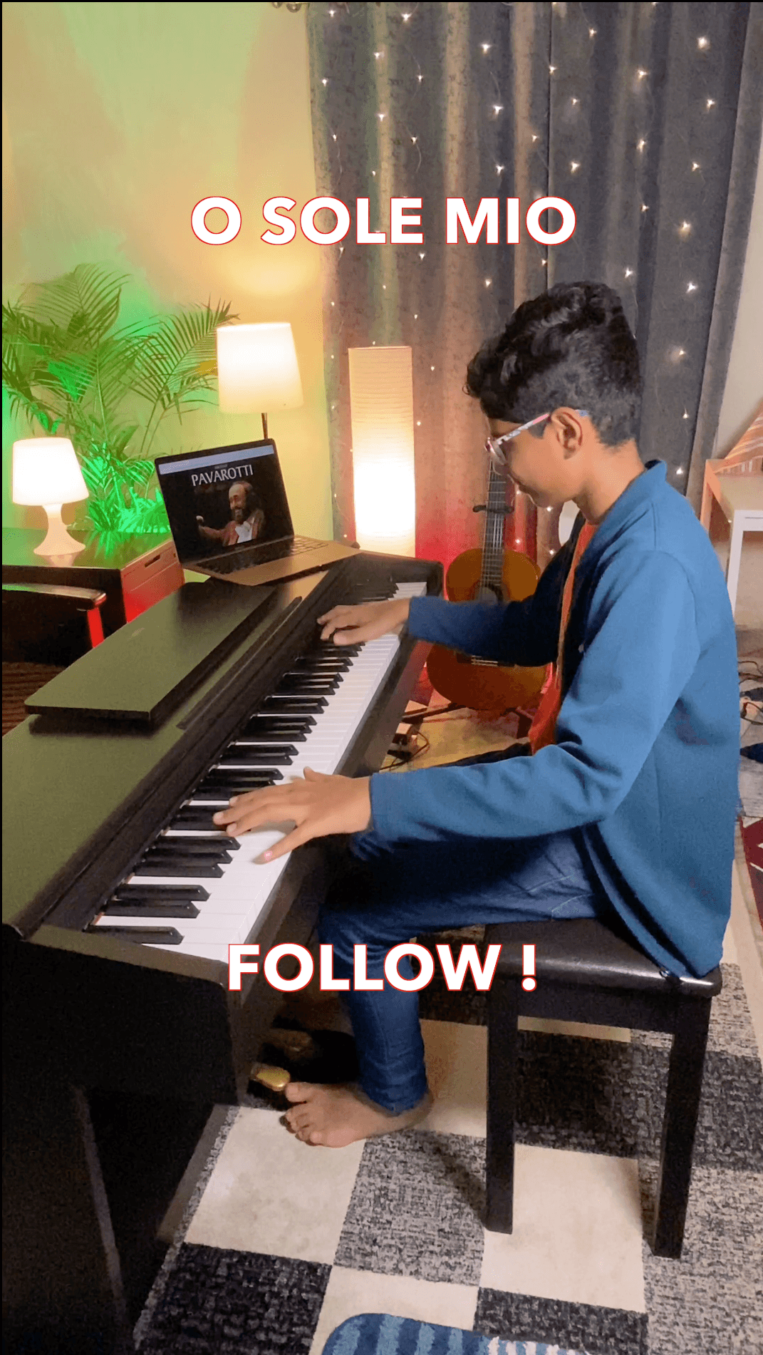 Bala playing a digital piano at home, with the words O Sole Mio across the photograph.